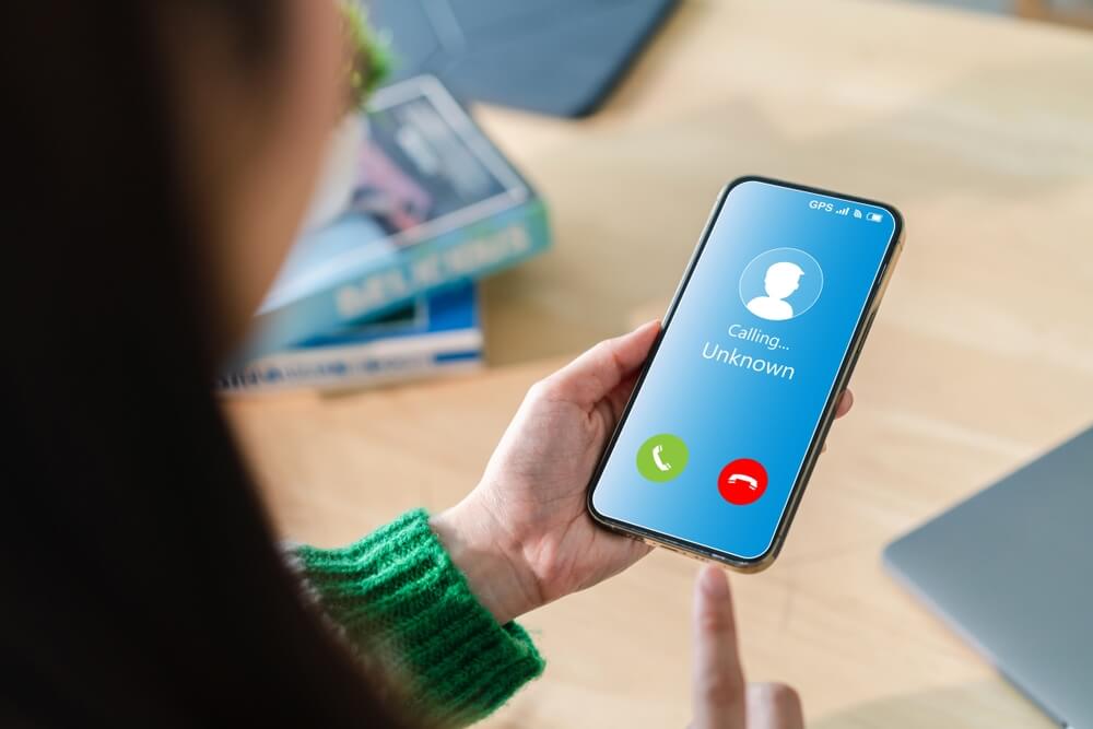 woman looking at unknown phone caller