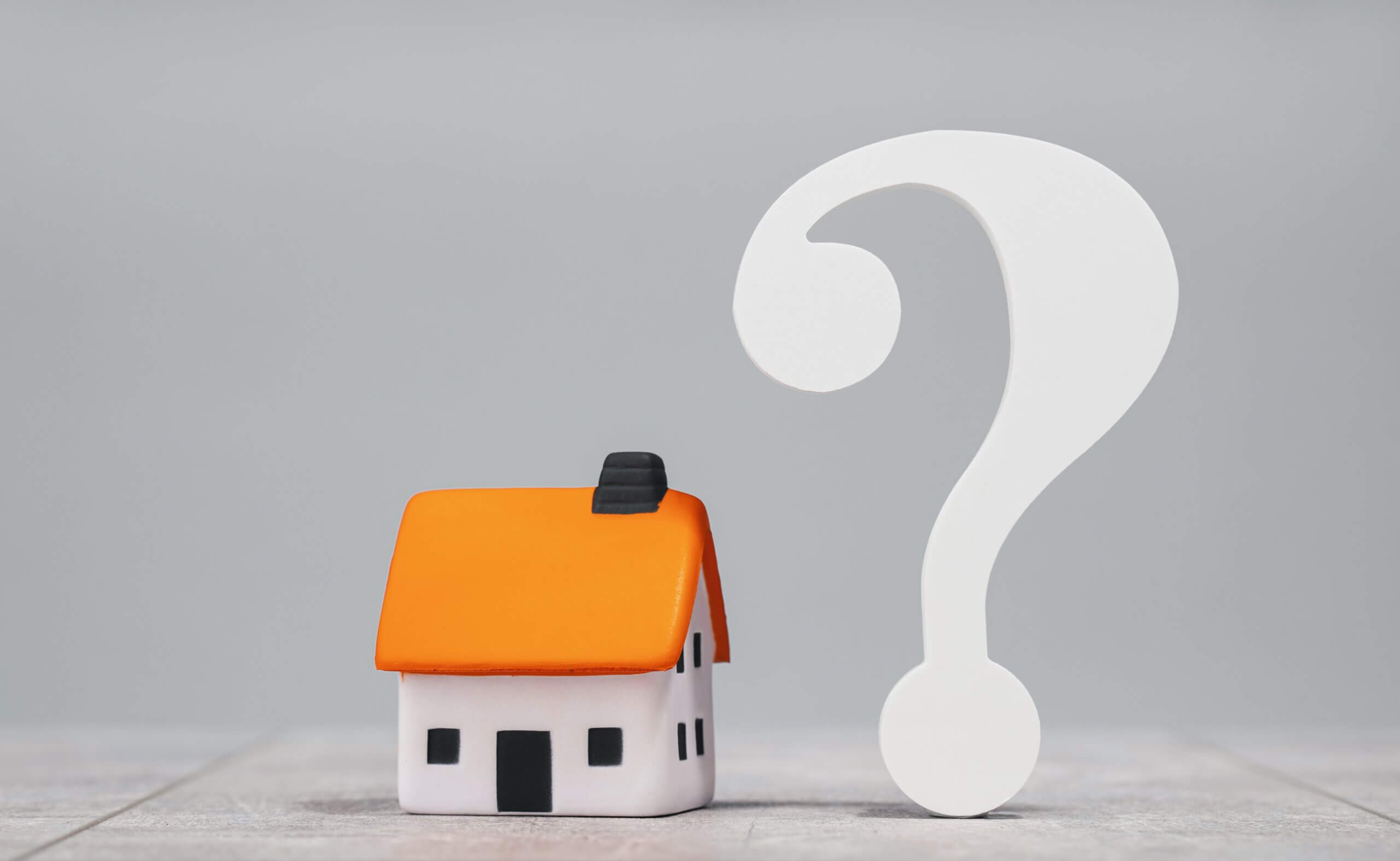 house with a question mark beside it