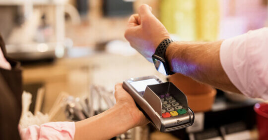 smartwatch wrist over pos terminal