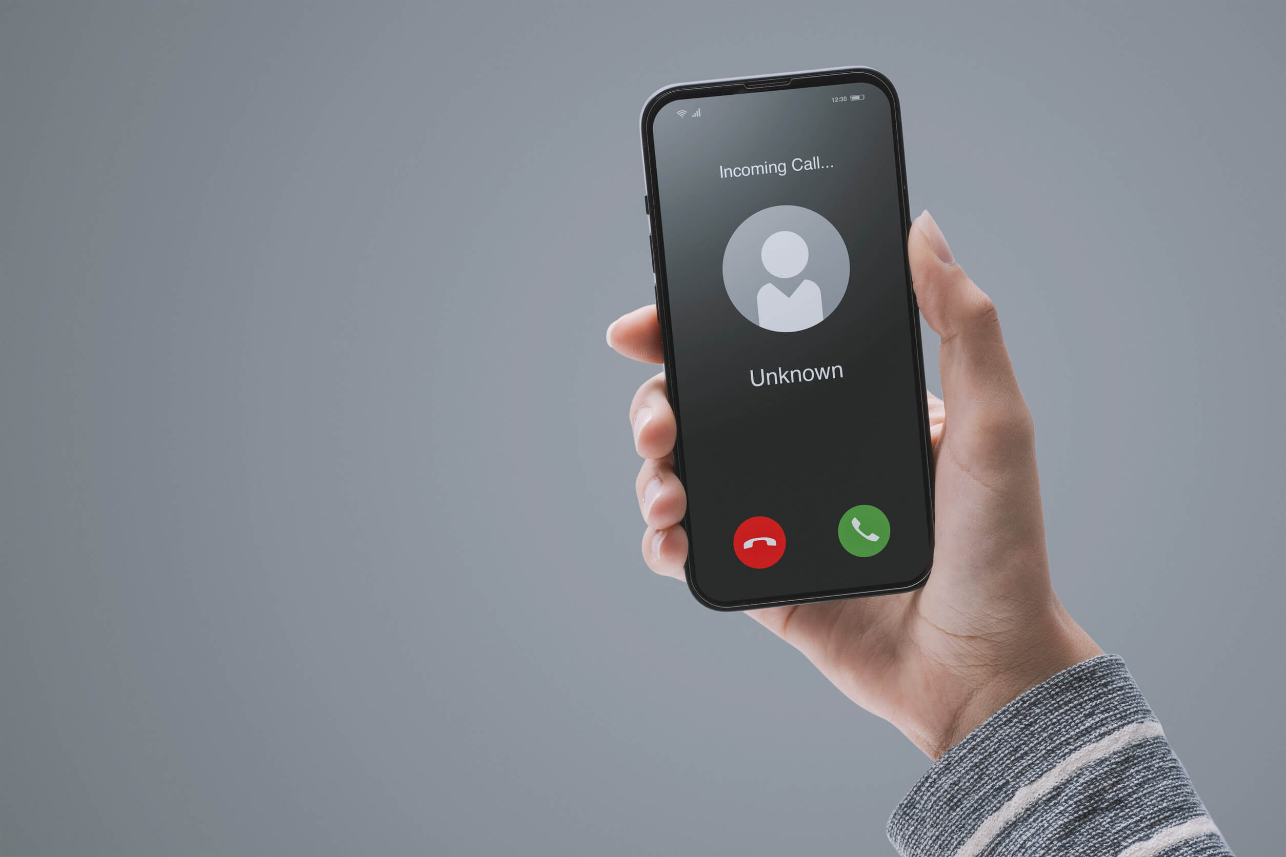 A woman getting a call from an unknown caller.